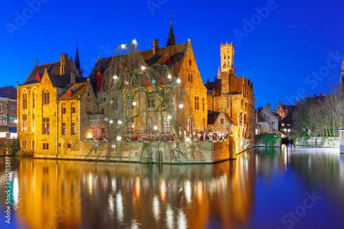 Scenic panorama with medieval fairytale town and tower Belfort from the quay Rosary, Rozenhoedkaai, in the evening, Bruges, Belgium
