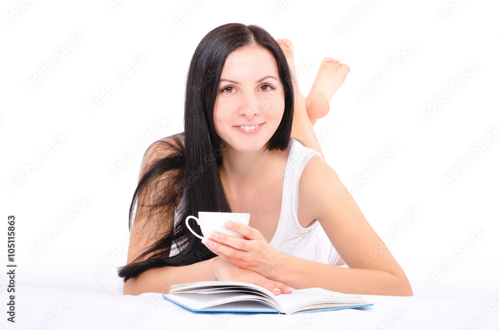 Beautiful young woman drinking coffee lying in bed Beautiful young woman drinking coffee lying in bed