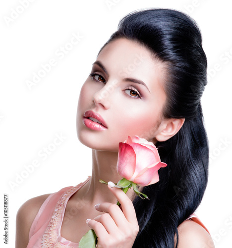 Sensual beautiful woman with pink rose.