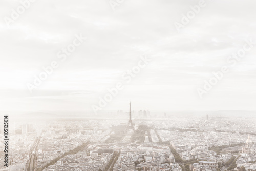 Paris, France skyline in misty fog. Eiffel Tower foggy, unique view.