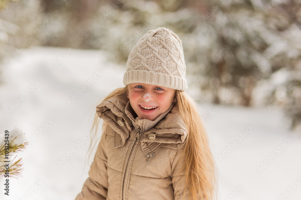 Girl laughing with snow on her nose
Girl laughing with snow on her nose