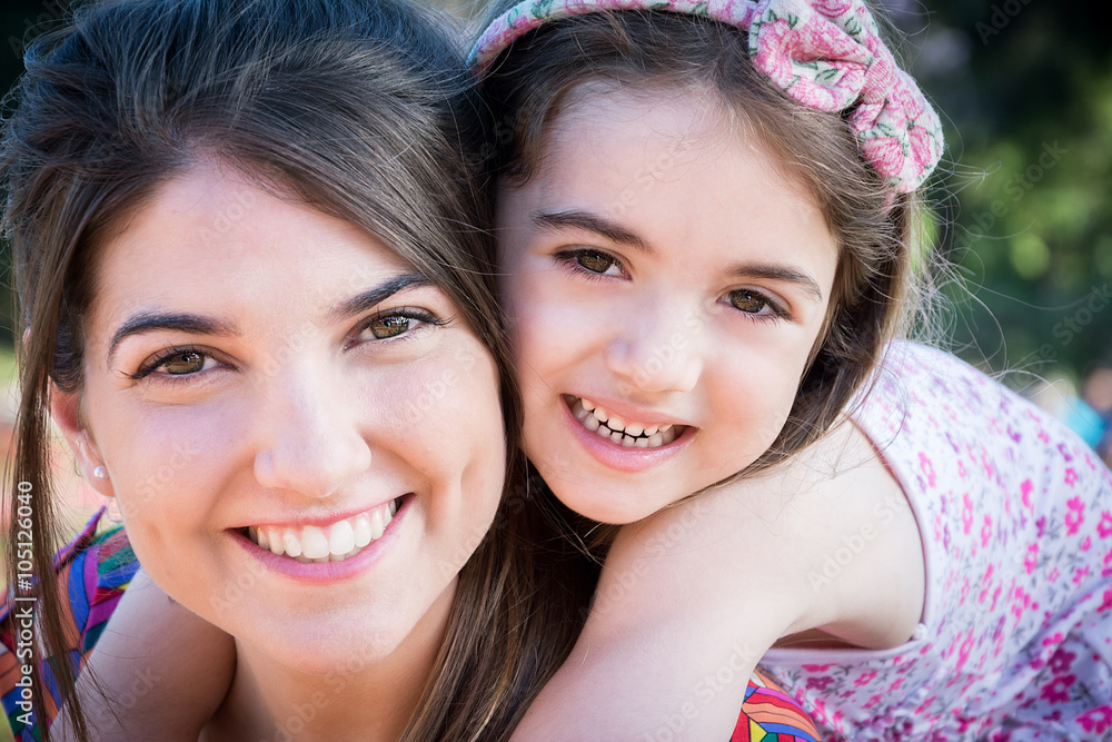 Mother and daughter in the park Mother and daughter in the park