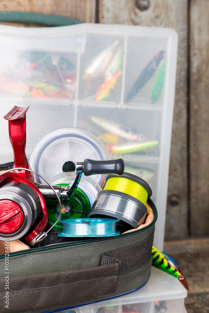 fishing tackles, lures and baits in boxes