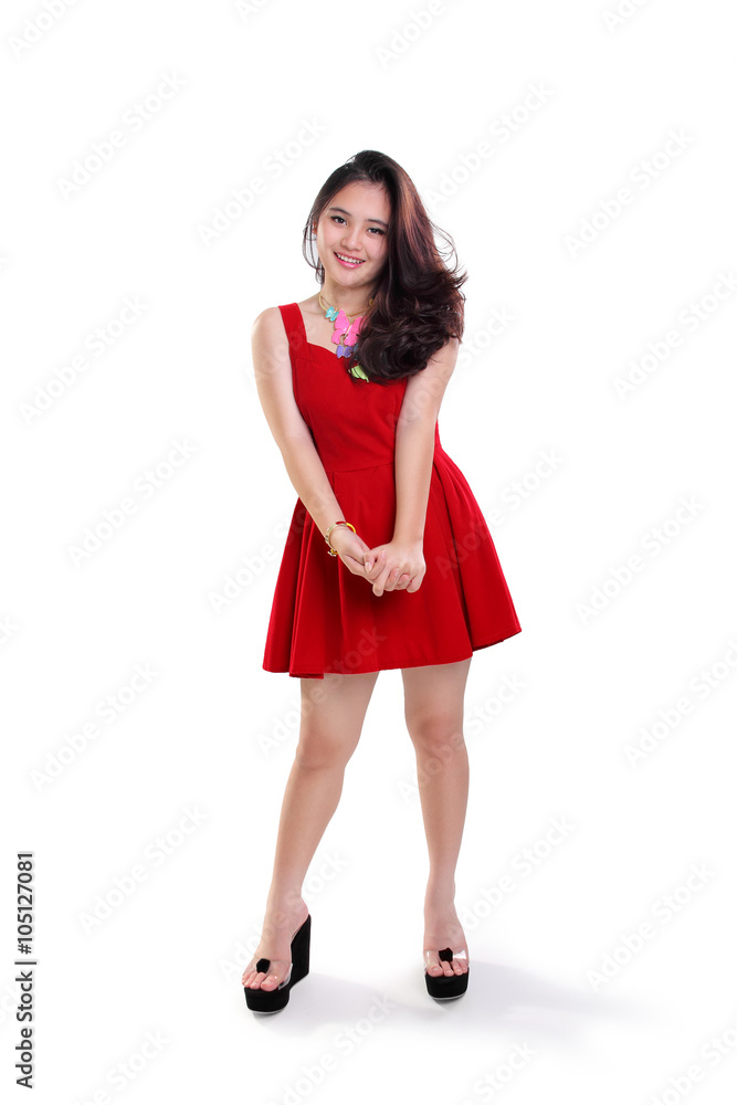 Stunning girl in red dress casual standing Stunning girl in red dress casual standing