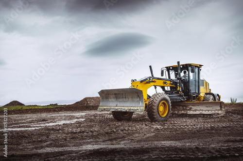 Road grader - heavy earth moving dirty  photo
