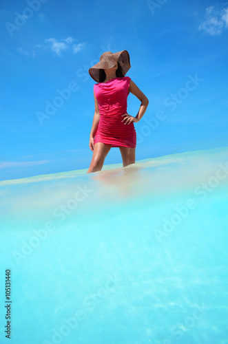 Carefree young woman enjoying clear tropical water