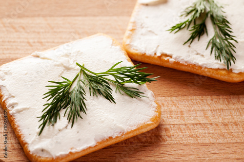 Crackers with spread cheese and dill