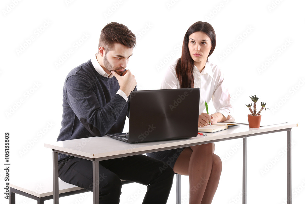 young students sitting at the table using notebook young students sitting at the table using notebook