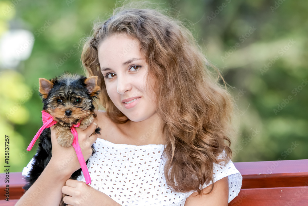 woman beautiful young happy with long hair holding small dog on woman beautiful young happy with long hair holding small dog on
