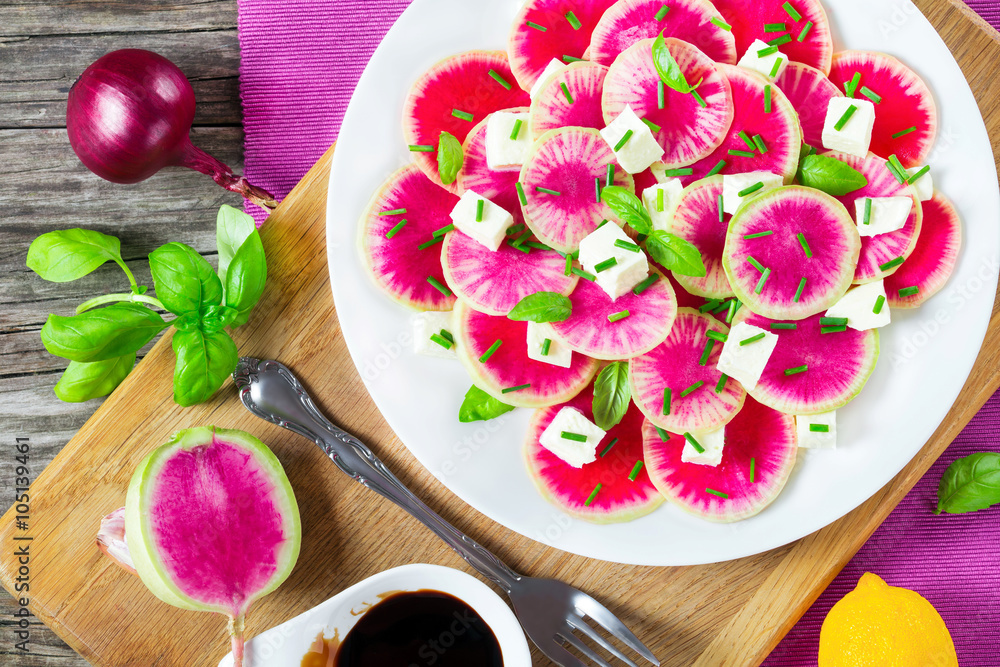 watermelon radish salad with mozzarella and basil, top view watermelon radish salad with mozzarella and basil, top view