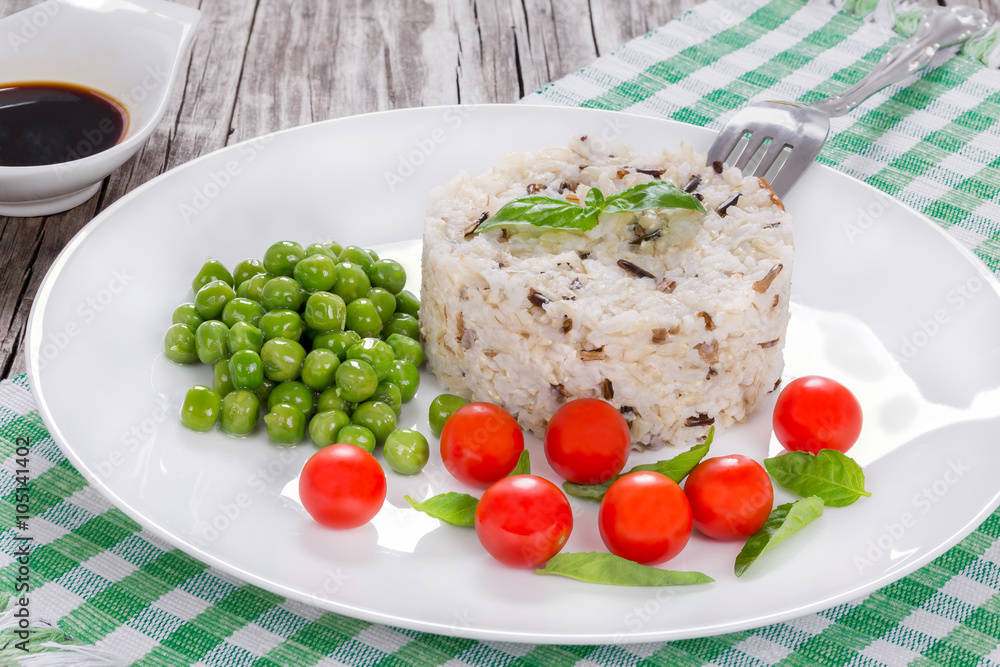 wild and brown organic rice with cherry tomatoes, green peas wild and brown organic rice with cherry tomatoes, green peas