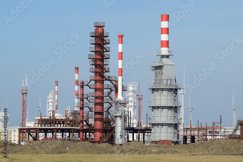 Distillation columns, pipes and other equipment furnaces refinery. photo