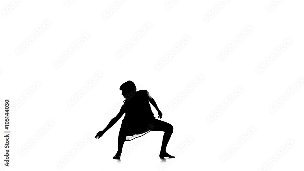 Young woman dancer goes on dancing contemporary dance on white, silhouette, slow motion Young woman dancer goes on dancing contemporary dance on white, silhouette, slow motion