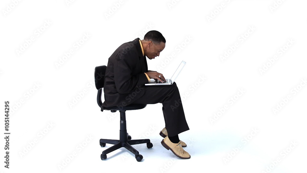 Businessman in chair with laptop computer Businessman in chair with laptop computer