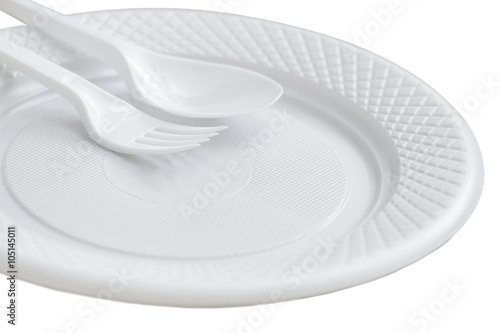 Disposable plastic plate, fork and knife. Isolated on white back