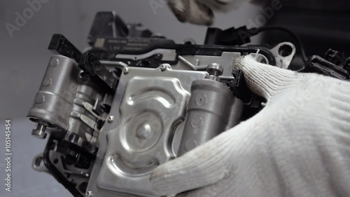 Repair Element of Automatic Car Transmission at Workshop photo