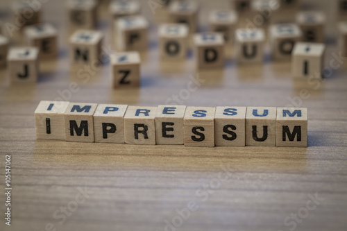 Impressum written in wooden cubes