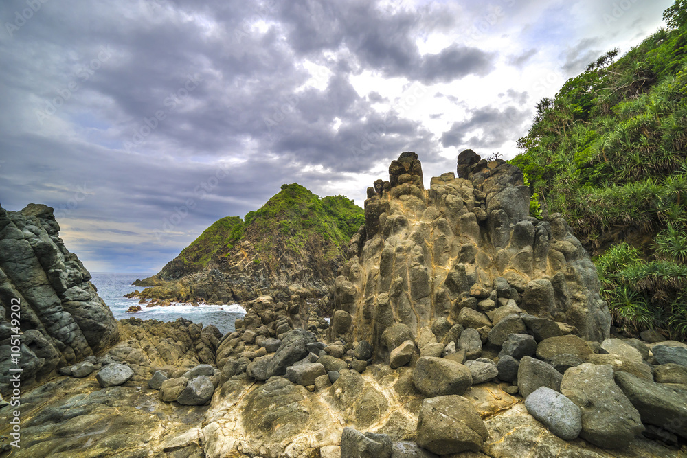 Natural rock with strong water wave and cloudy sunset background at Pantai Semeti Lombok, Indonesia. Natural rock with strong water wave and cloudy sunset background at Pantai Semeti Lombok, Indonesia.