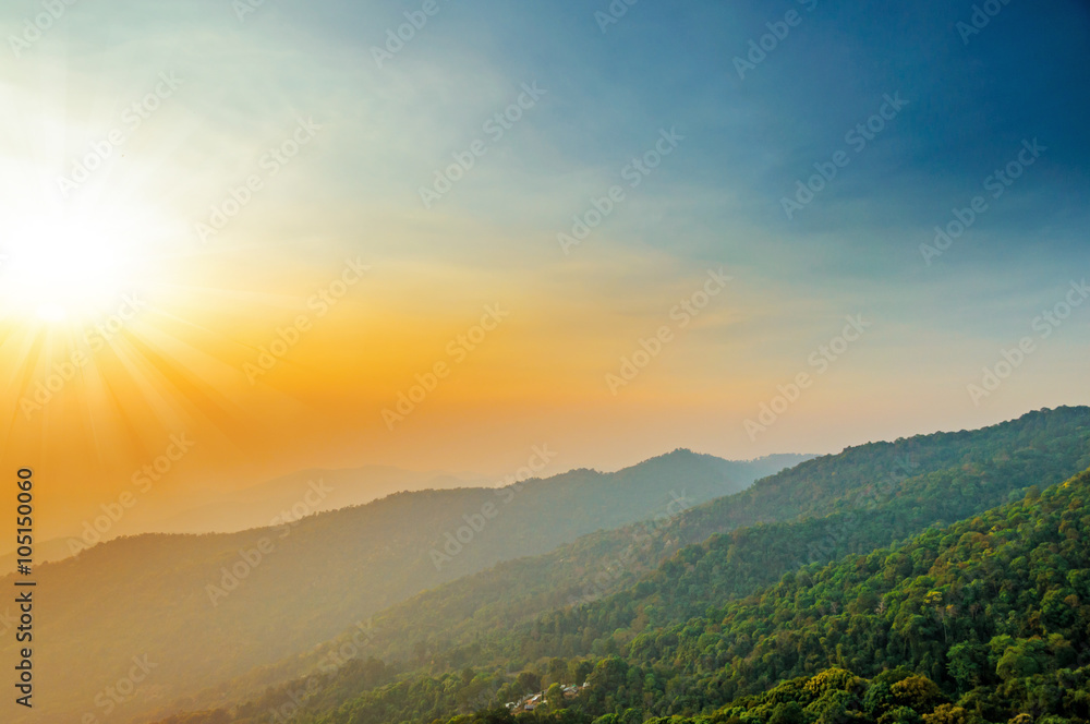 blue color of mountains during sunset with sun rays ,Chiang Mai , Thailand