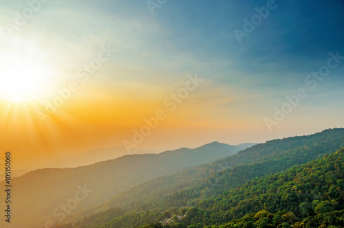 blue color of mountains during sunset with sun rays ,Chiang Mai , Thailand