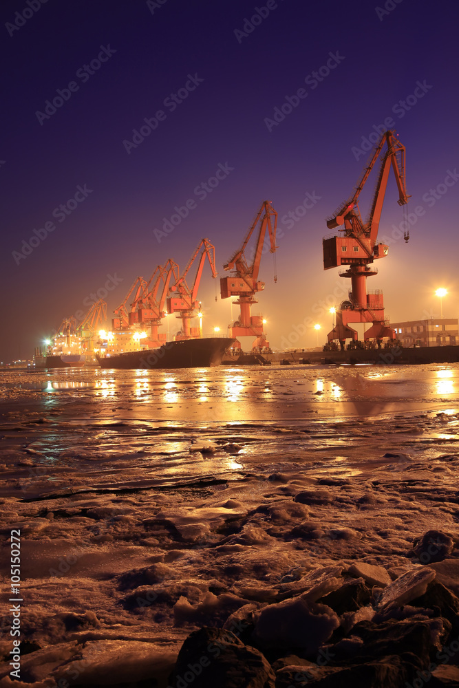 Cargo wharf crane at night