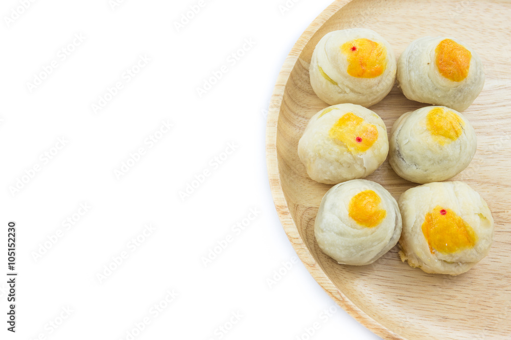 Chinese Pastry Mung Bean or Mooncake with Egg Yolk on wooden dish Chinese Pastry Mung Bean or Mooncake with Egg Yolk on wooden dish