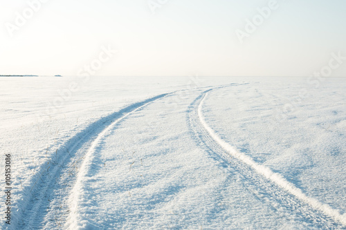 snow desert and the tracks of the car in the snow © Vadim Fogel
