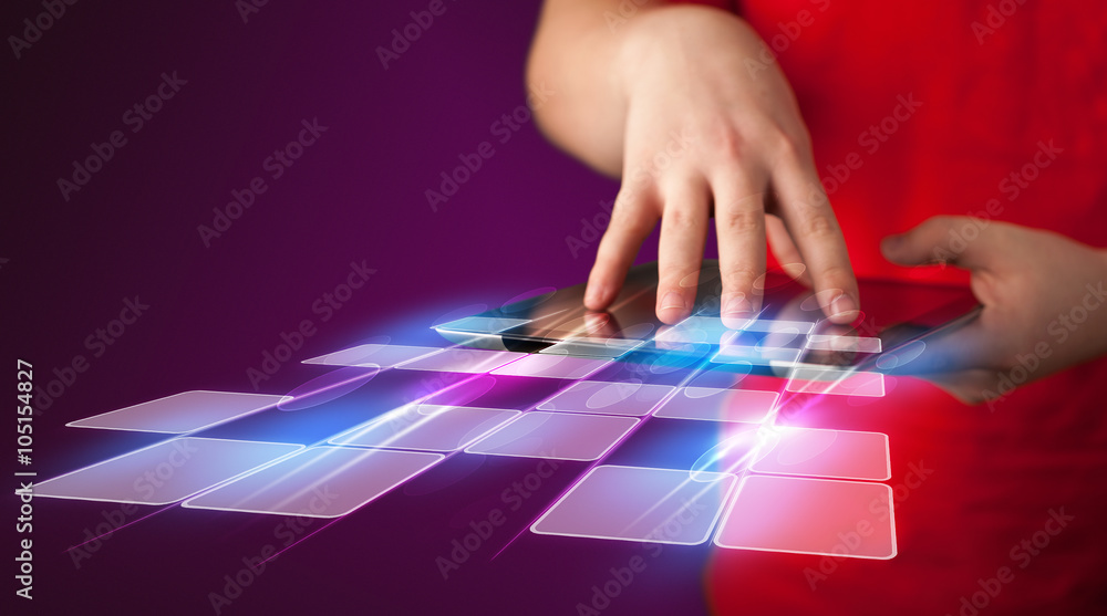 Naklejka premium Close up of hand holding tablet with cyber application