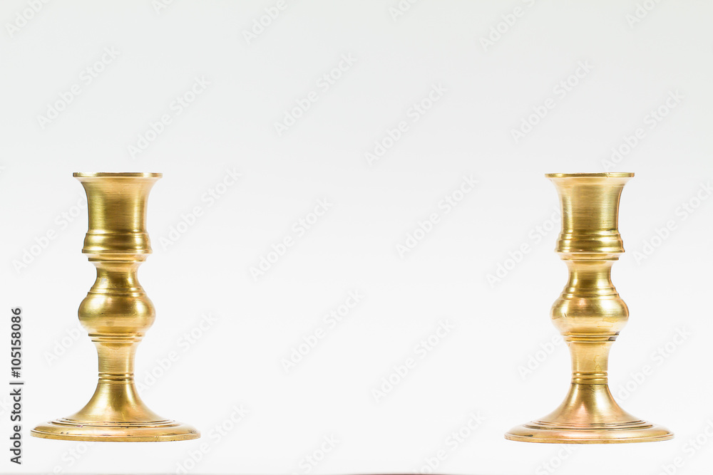 Antiquee brass candle stick on white background