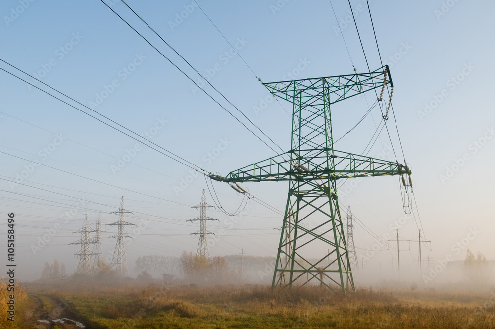 High-voltage power line against landscape