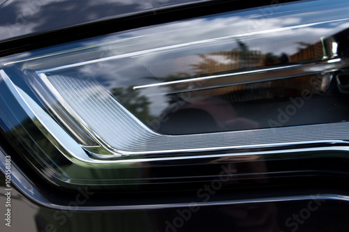 Closeup of car headlight, front view