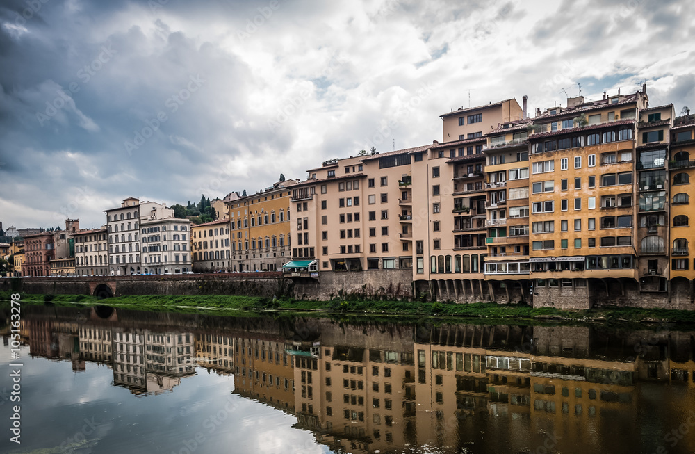 Buildings reflecting in Arno river in Florence,Italy.