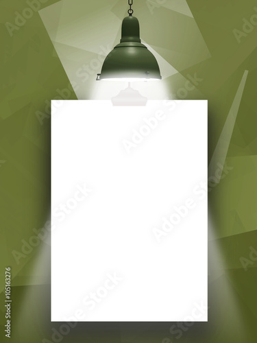 Close-up of one hanged paper sheet with lamp on geometric abstract green background