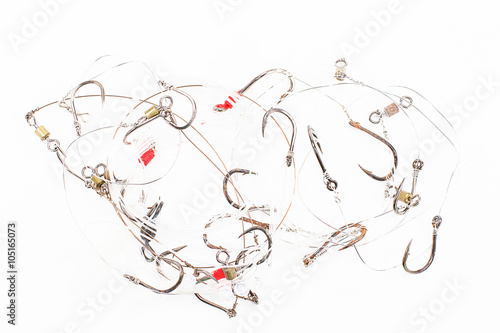 Old rusty fishing lines and hooks isolated on white background