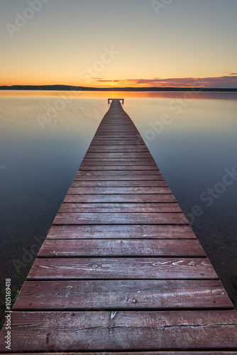 Old wooden pier on sunset