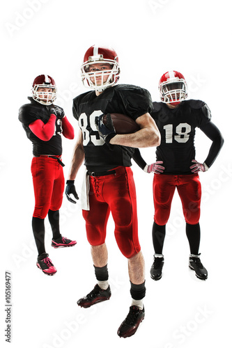 The three american football players posing with ball on white background © master1305