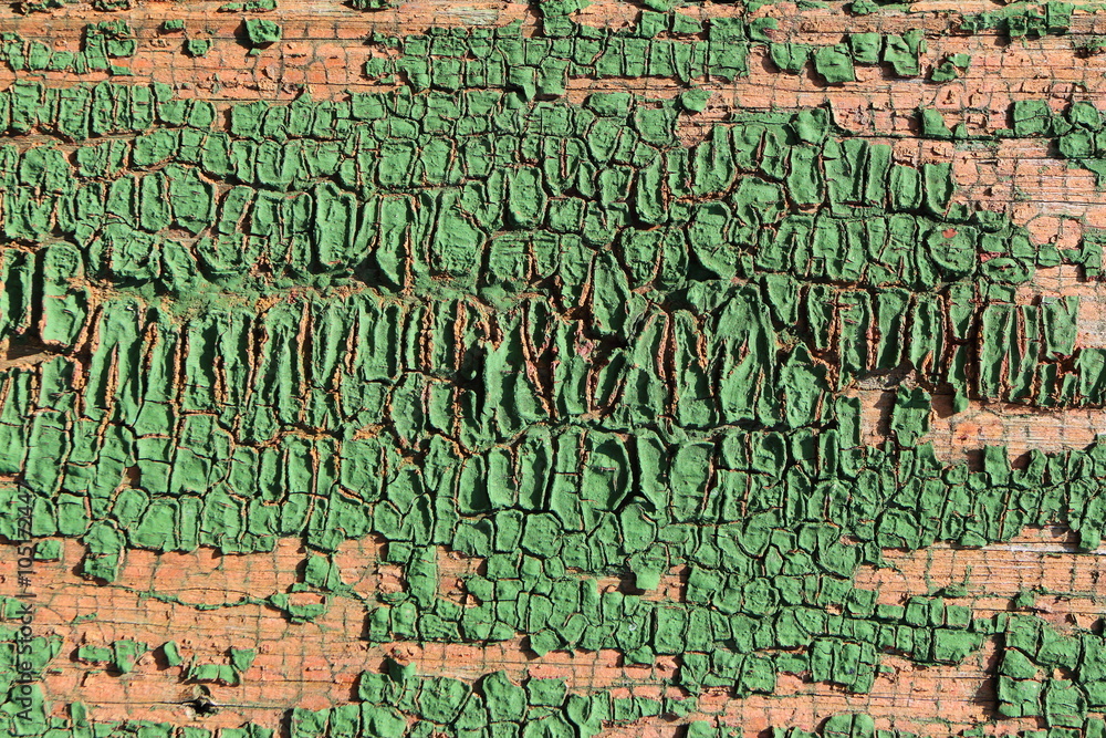 Fototapeta premium Old weathered cracked painted wall of an old village house