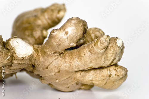 detail of ginger root similar to a hand isolated on white background