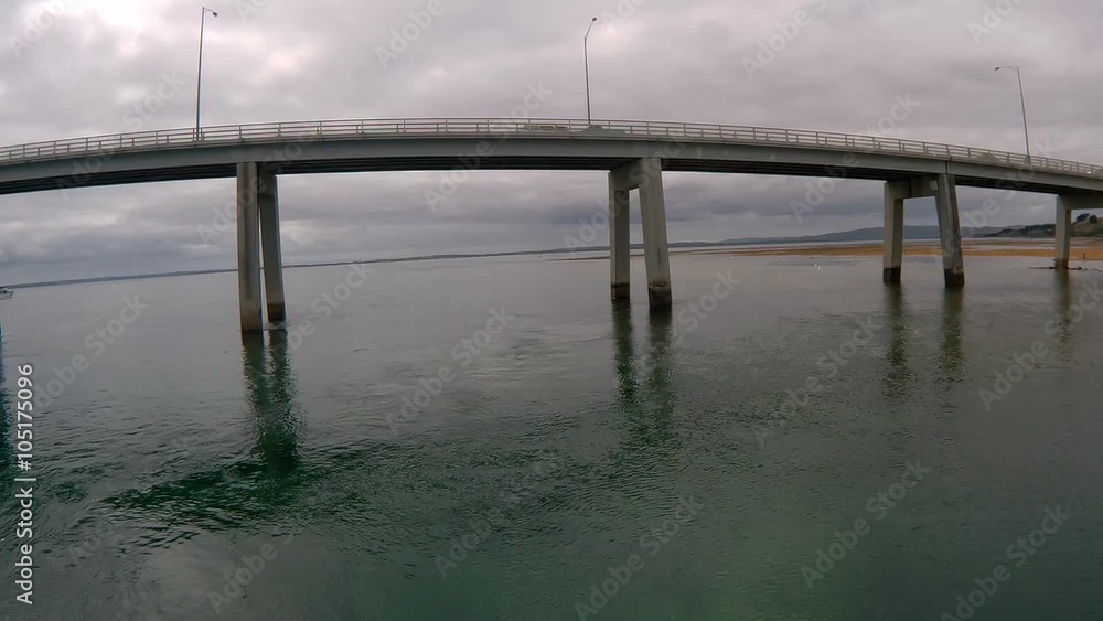 Static shot of Phillip Island bridge with cars passing by Static shot of Phillip Island bridge with cars passing by