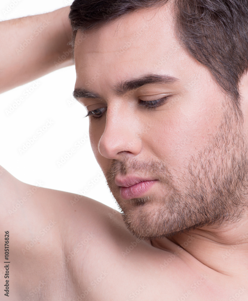 Fototapeta premium Close-up portrait of happy smiling young man.