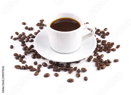 Black coffee in a mug with saucer coffee beans are scattered isolated