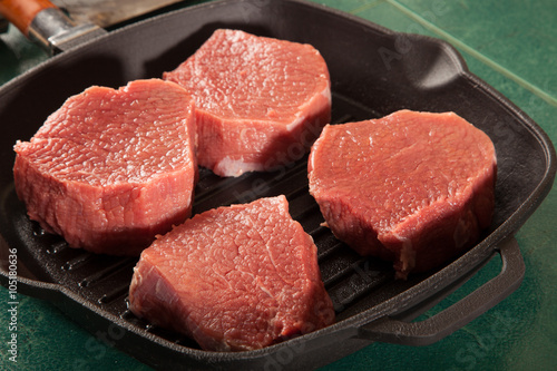 Above view of raw fresh marbled meat steaks, studio shot, closeup