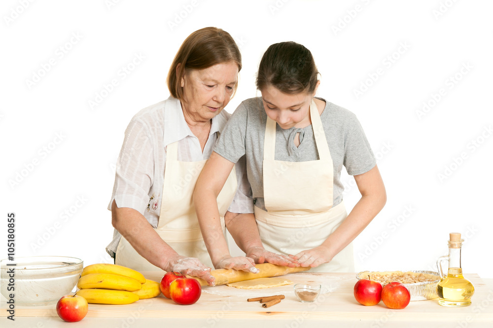 the grandmother and the granddaughter roll dough the grandmother and the granddaughter roll dough