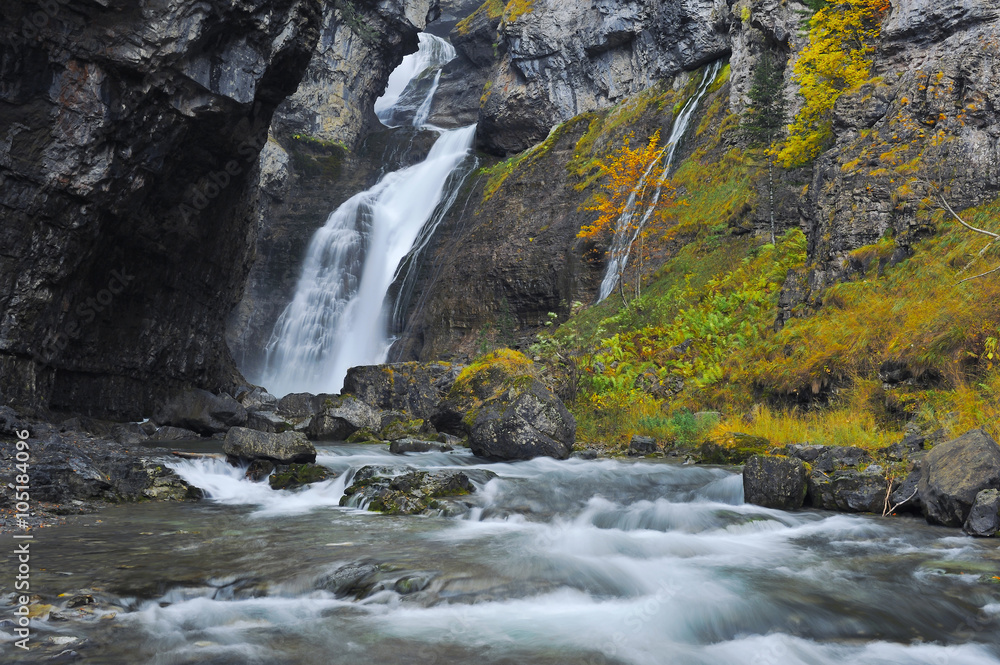 Fototapeta premium Waterfall in a mountain gorge. Ordesa National Park. Aragon Province. Spain