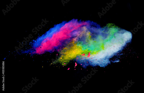 Explosion of colored powder on black background