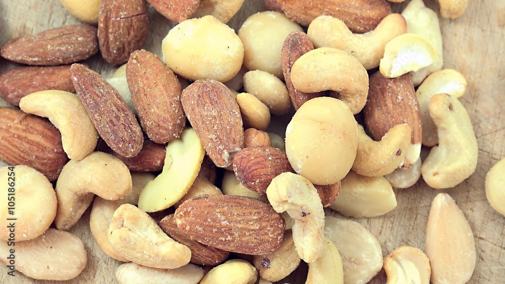 Heap of rotating mixed Nuts (not loopable 4K footage) Heap of rotating mixed Nuts (not loopable 4K footage)