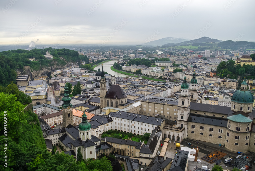 Aerial view of the historic city of Salzburg at fog and cloudy weather, Salzburgerland, Austria