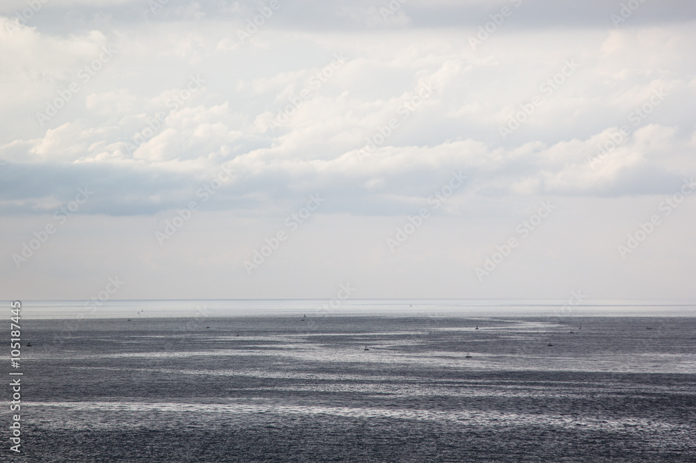 The sea and the clouds on a summer day. Breeze. Background. The sea and the clouds on a summer day. Breeze. Background.