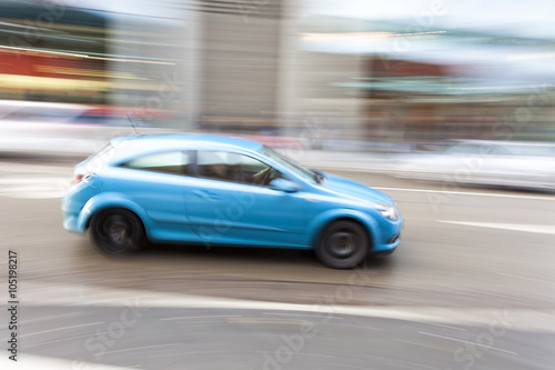 Car in motion blur, car driving fast in city © FotoKachna