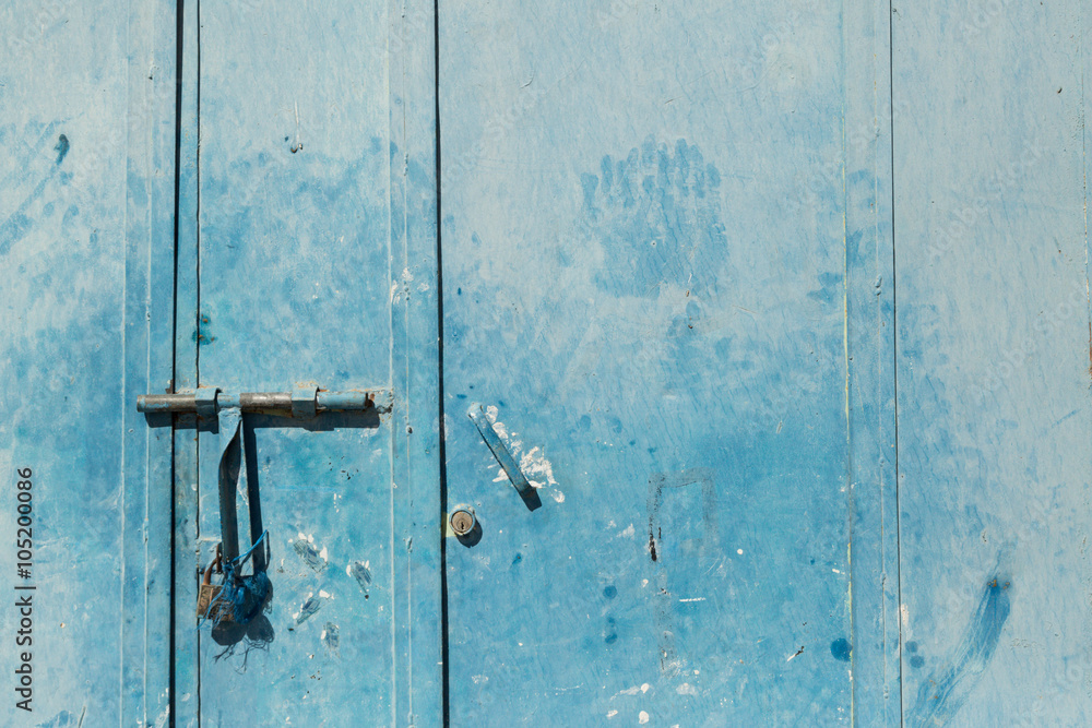 blue door with lock and hand print in Merzouga